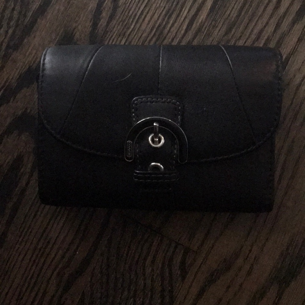 Black coach wallet. Never been used